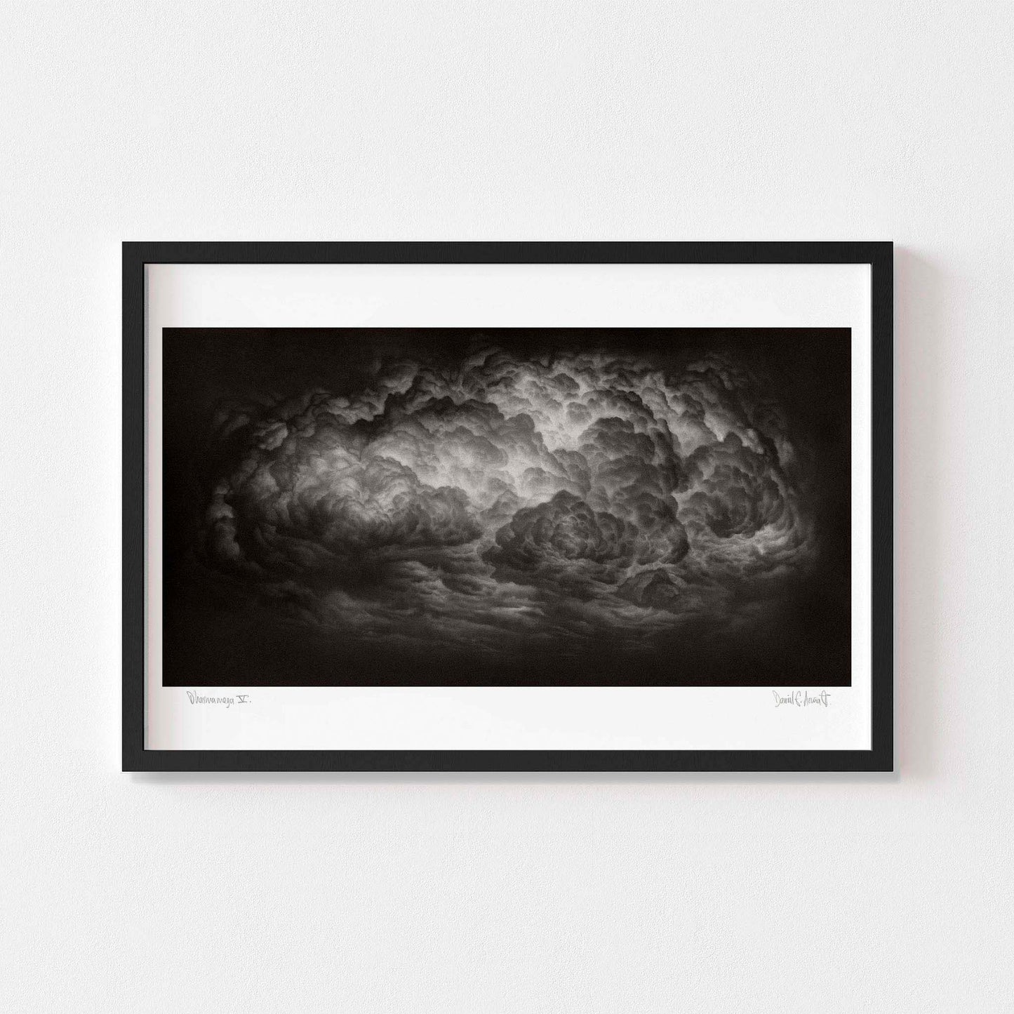 Large dramatic black and white art print of a cloud framed in black.