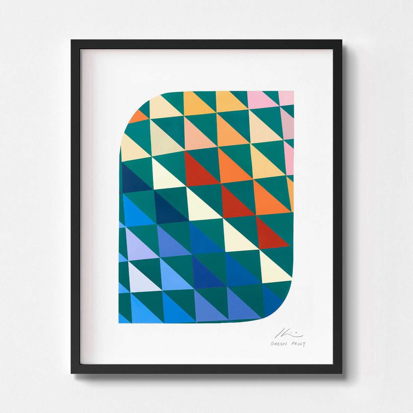Geometric wall art in a black frame.