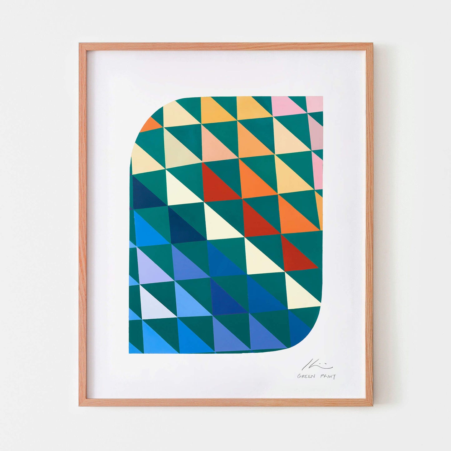Geometric wall art in an oak frame.