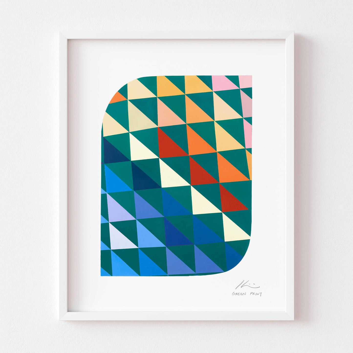 Geometric wall art in a white frame.