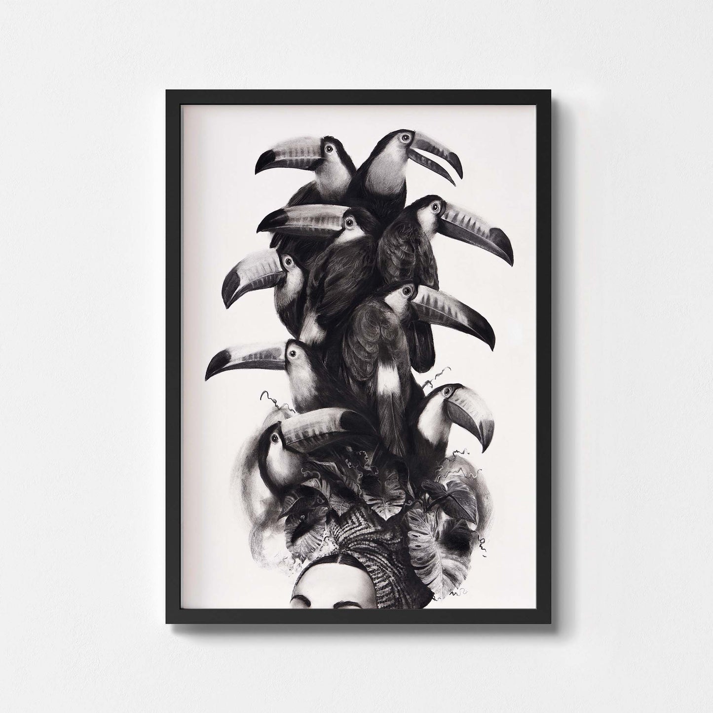 Black and white wall art print of a women wearing a toucan headdress framed in black.