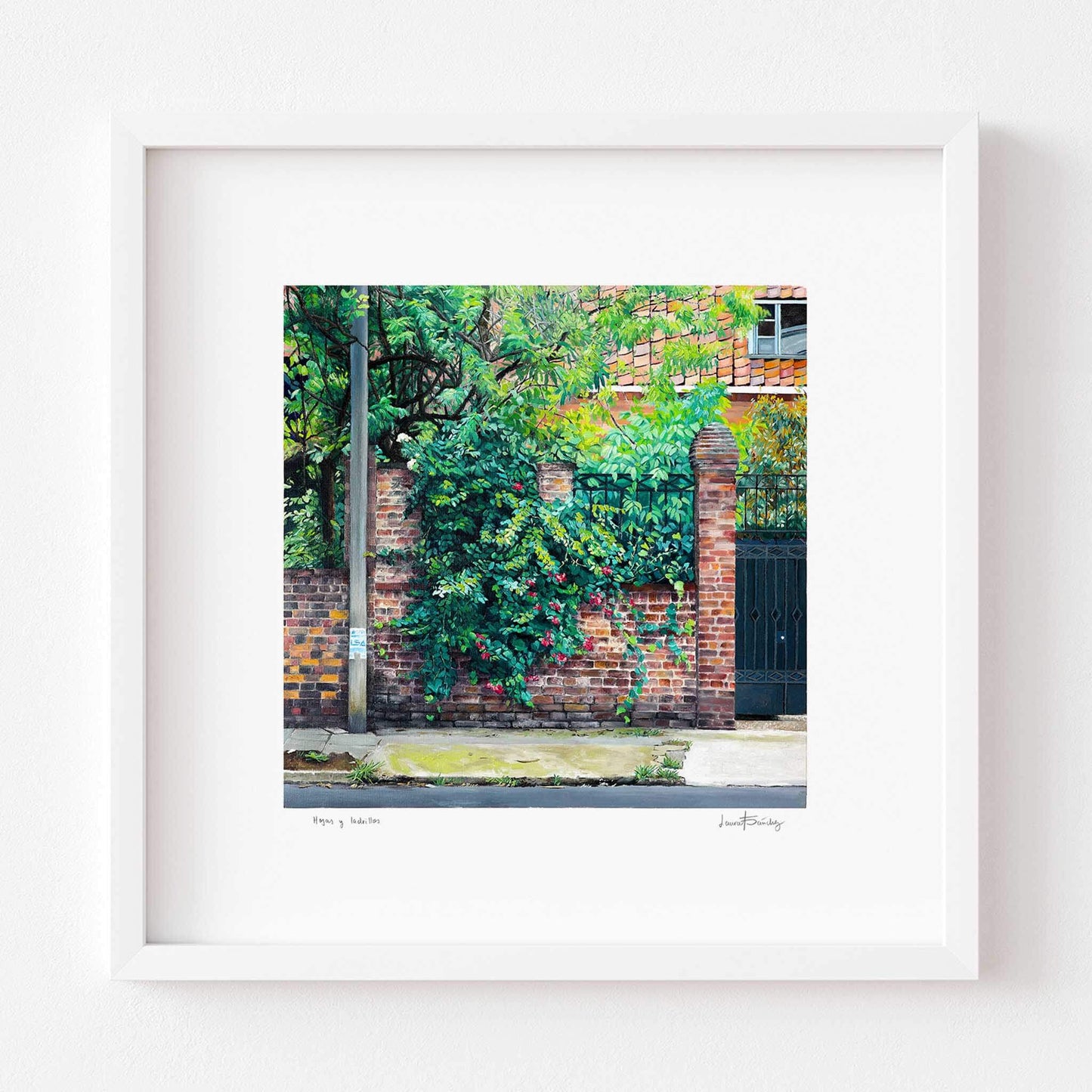Landscape art print in a white frame.