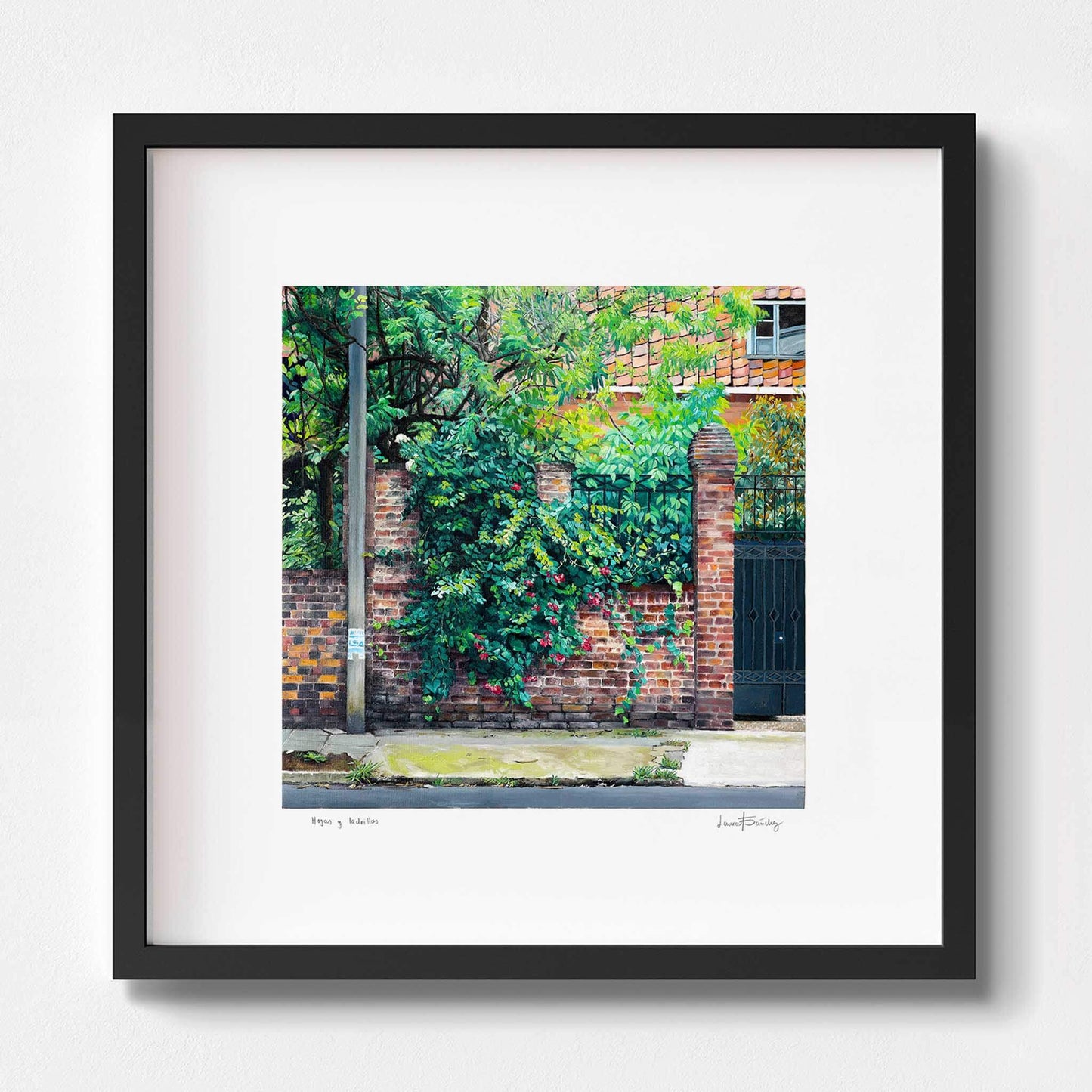 Landscape art print in a black frame.