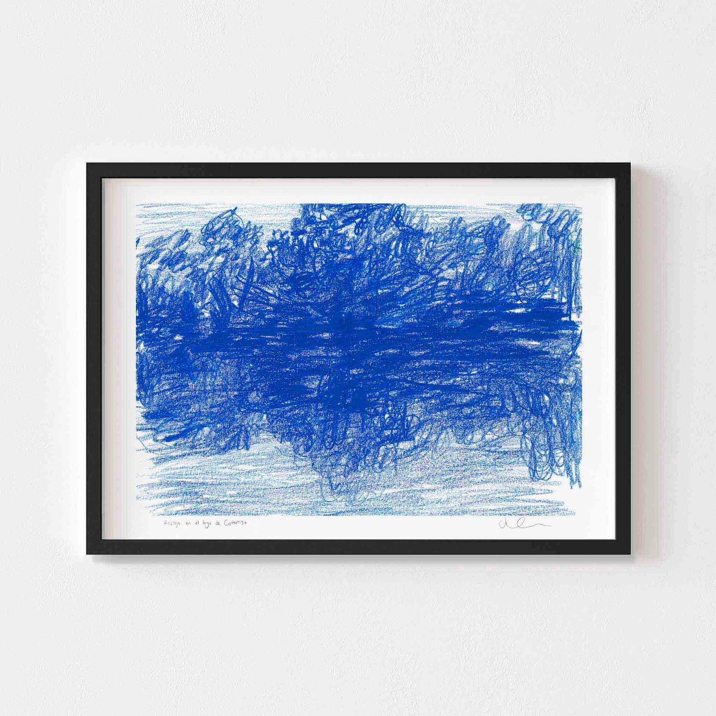 Horizontal blue landscape wall art print framed in black.