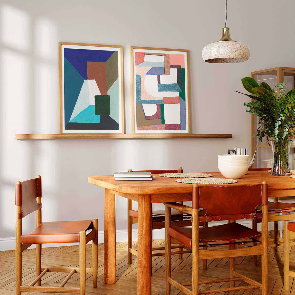 
                  
                    Pair of modern geometric art wall prints in a contemporary dining room.
                  
                