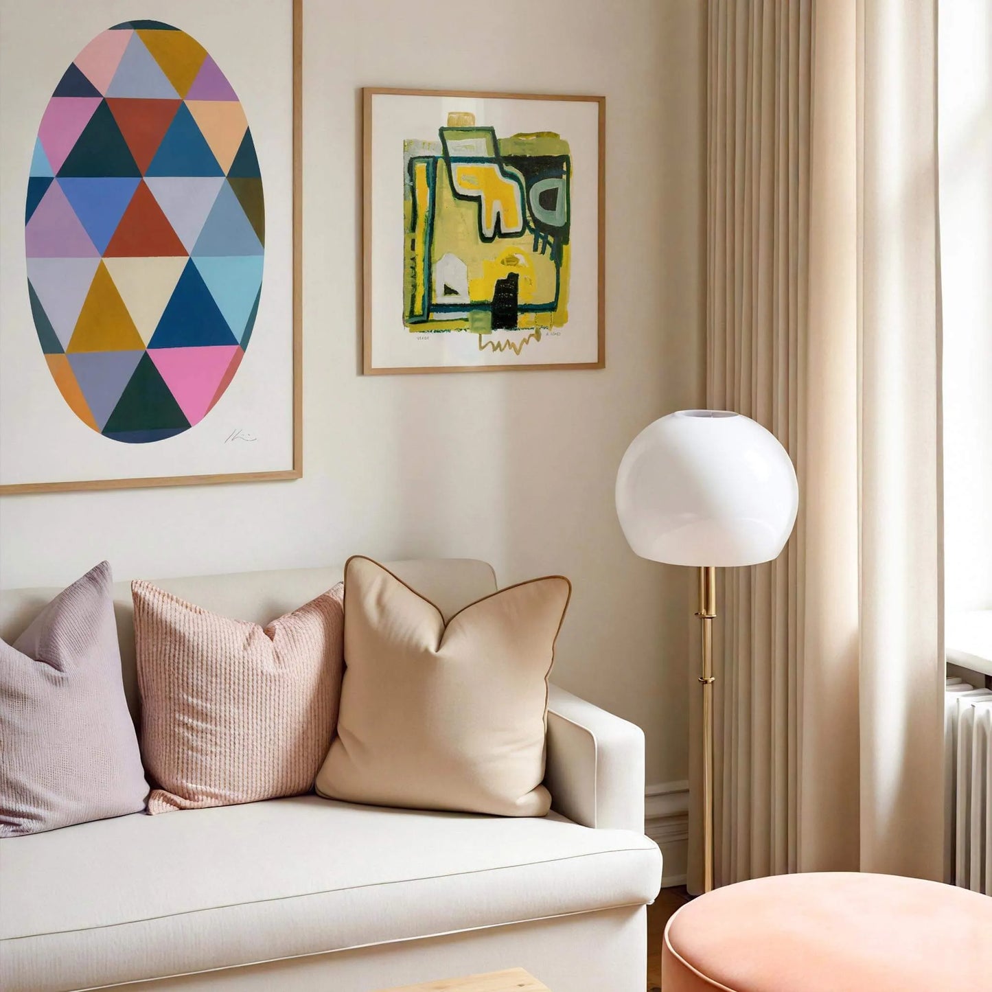 Living room with a white sofa, colorful cushions, and abstract art on the wall.