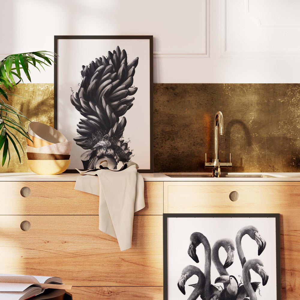 
                  
                    Pair of black and white wall art prints in a kitchen.
                  
                