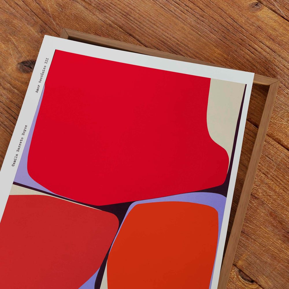 
                  
                    Unframed bright red contemporary art poster on a wooden tabletop.
                  
                