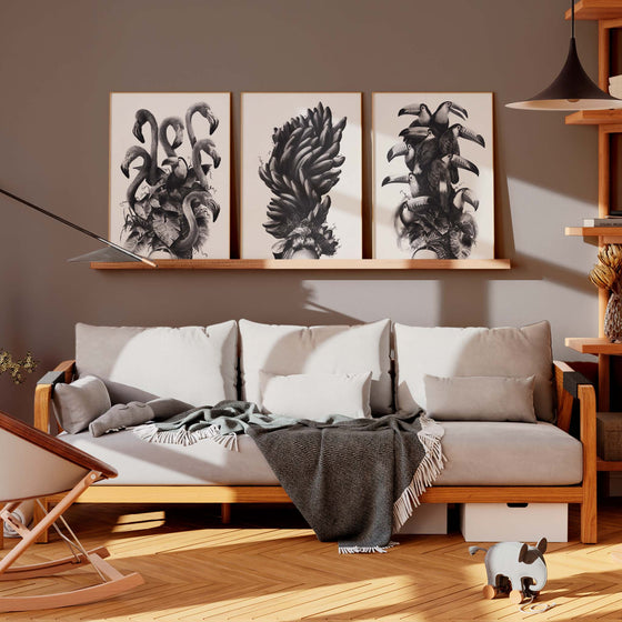 Set of three black and white wall art prints in a modern living room.