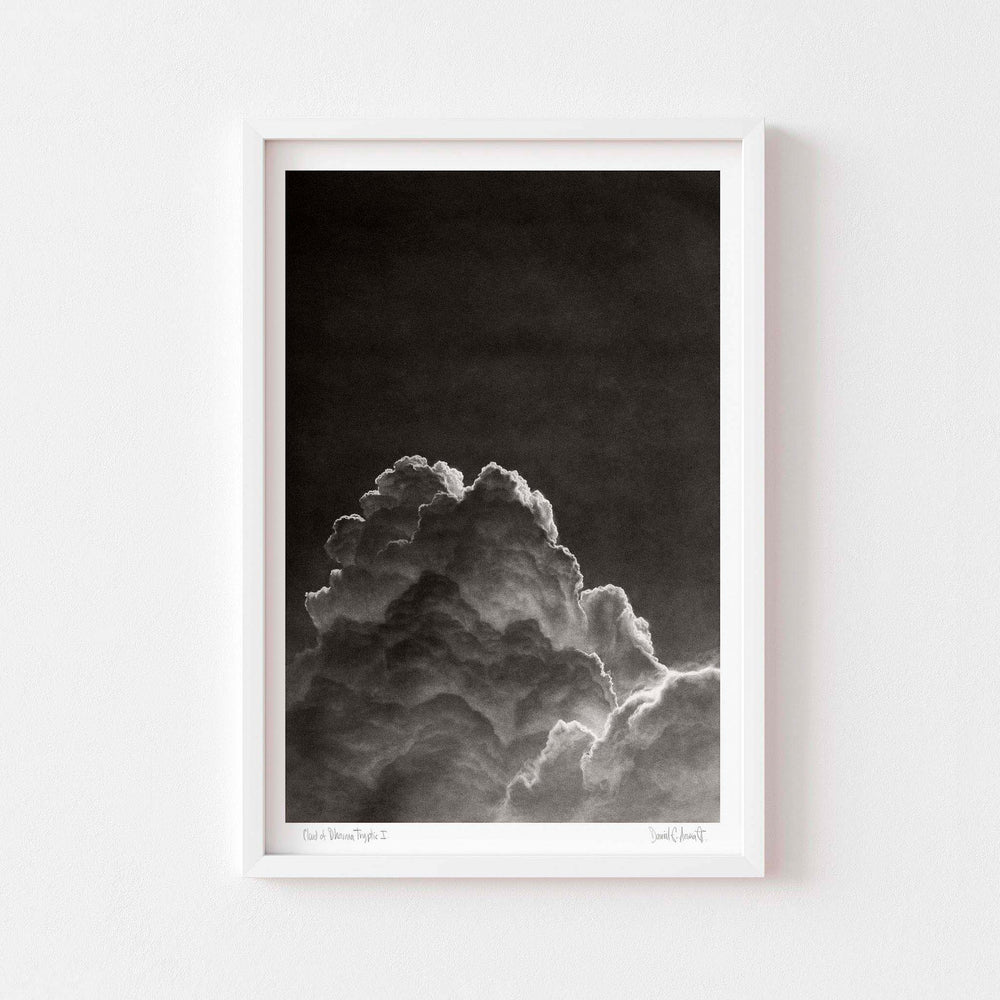 Black and white wall art print of a cloud in a white frame.