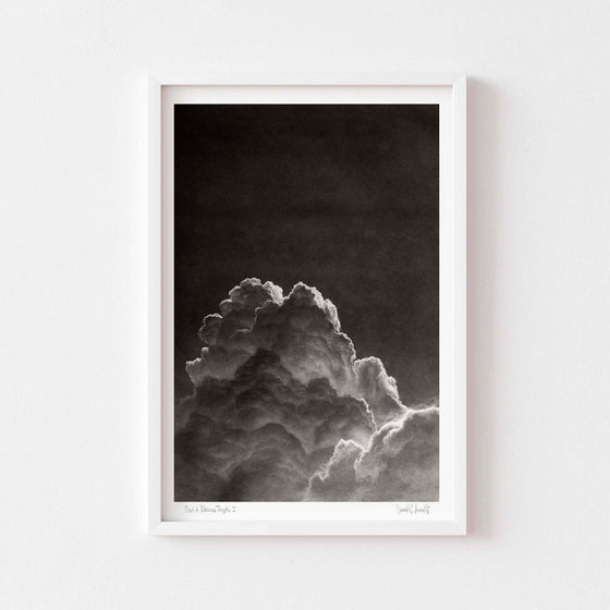 Black and white wall art print of a cloud in a white frame.