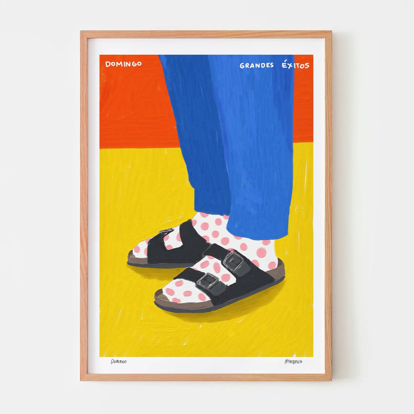 Oak framed artwork of a person wearing sandals and polka dot socks on a colourful background.