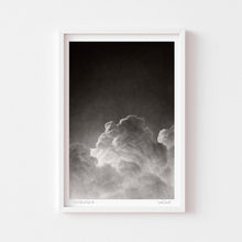  Black and white art wall print of a cloud framed in white.