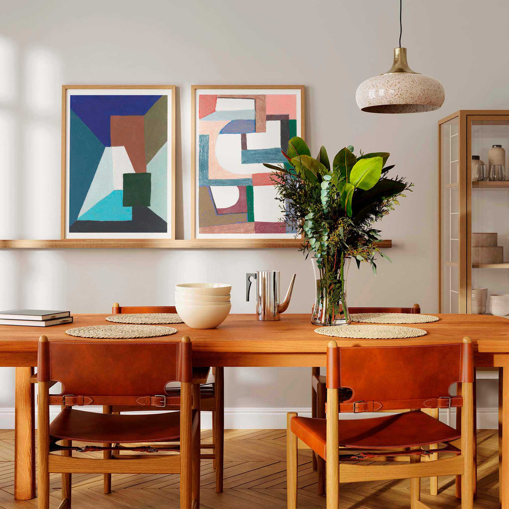 
                  
                    Pair of modern abstract art posters in a contemporary dining room.
                  
                