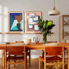 Pair of modern abstract art posters in a contemporary dining room.