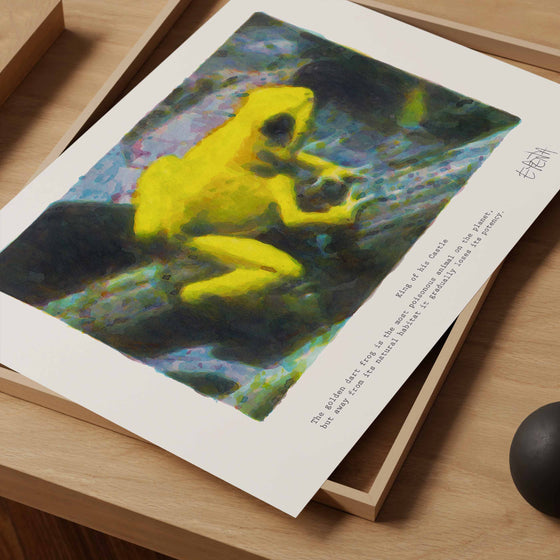 Unframed small animal art print of a yellow frog in a neutral home studio.