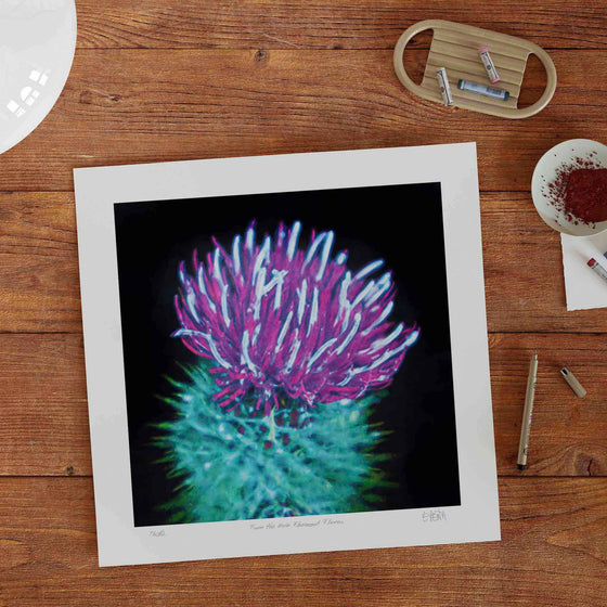 Unframed botanical wall art print on a desk in a modern home.