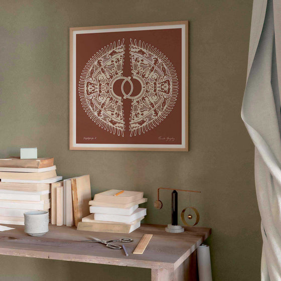 Large brown papercut art print hanging in a modern home office.