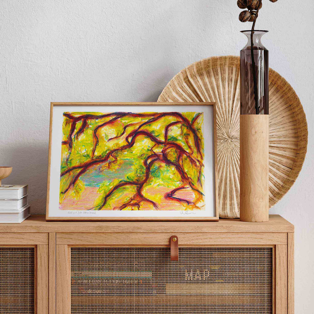 Yellow and red framed art print in a neutral living room.