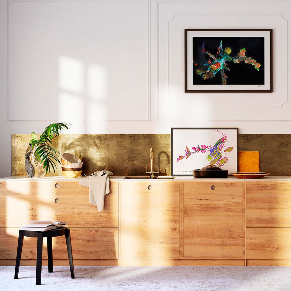 
                  
                    Pair of modern botanical art prints in a contemporary kitchen.
                  
                