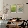 Pair of botanical art wall prints in a modern dining room.