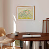 Large neutral wall art print framed in oak and displayed in a modern living room.