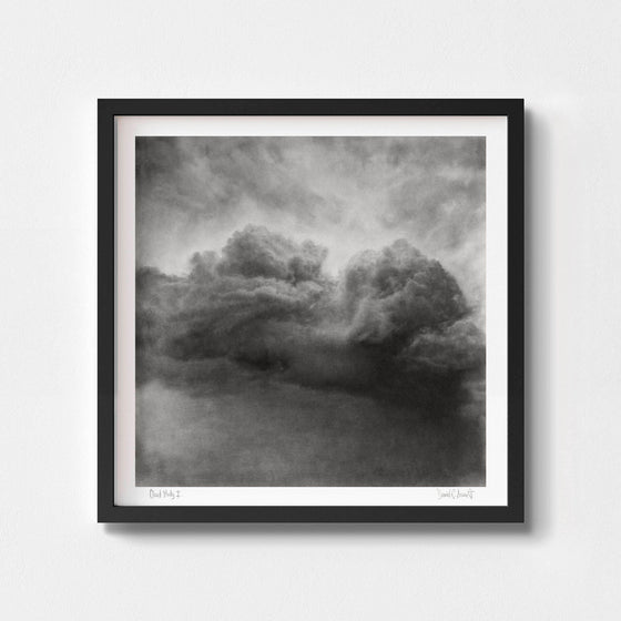 Large black and white art print of a cloud in a black frame.