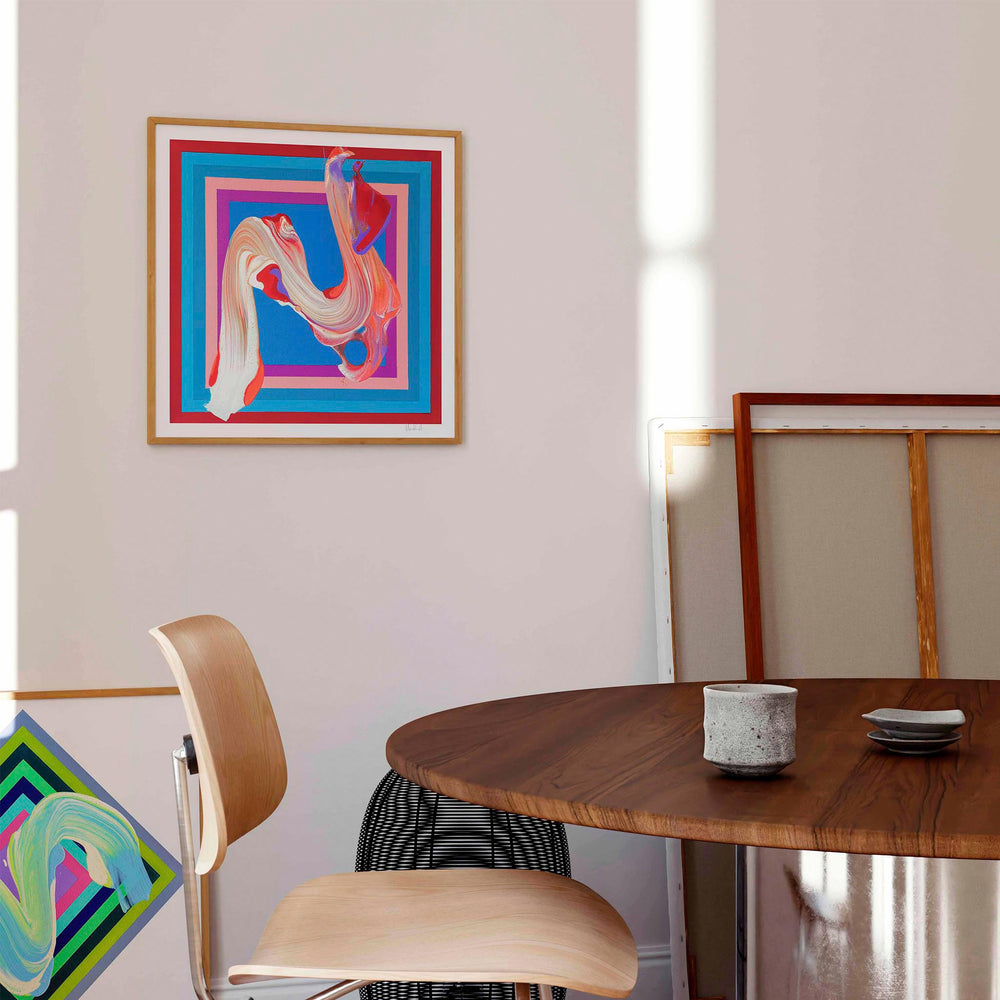 
                  
                    Framed red and blue abstract art print in a modern scandinavian interior.
                  
                