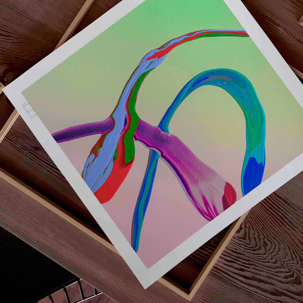 
                  
                    Unframed colourful wall art print on a wooden tabletop.
                  
                