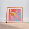 Framed pink and orange contemporary art print in a neutral interior.