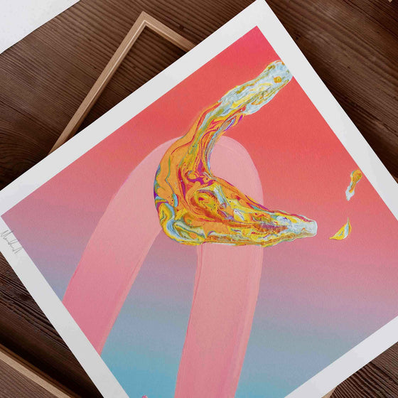 Bright pink modern art print unframed on a wooden desk.