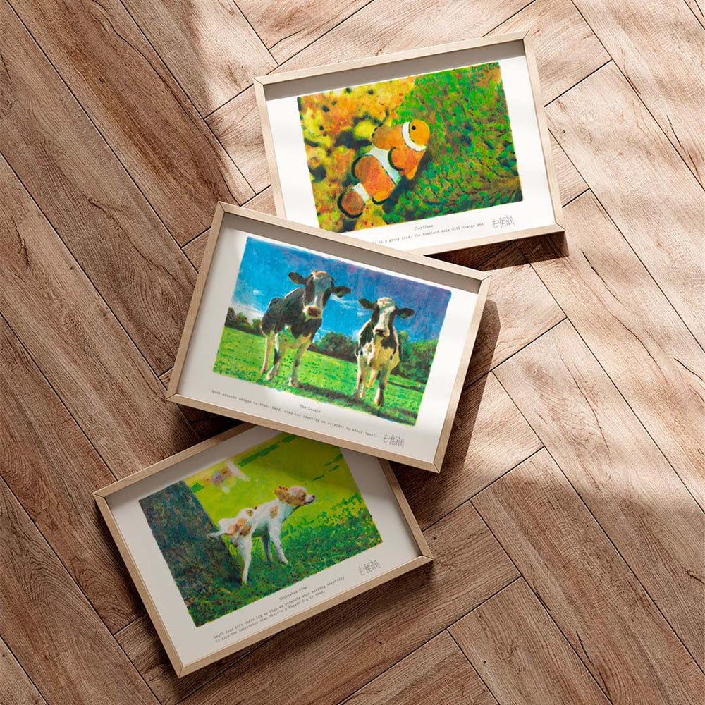 
                  
                    Set of three animal wall art prints framed in oak on a neutral living room floor.
                  
                