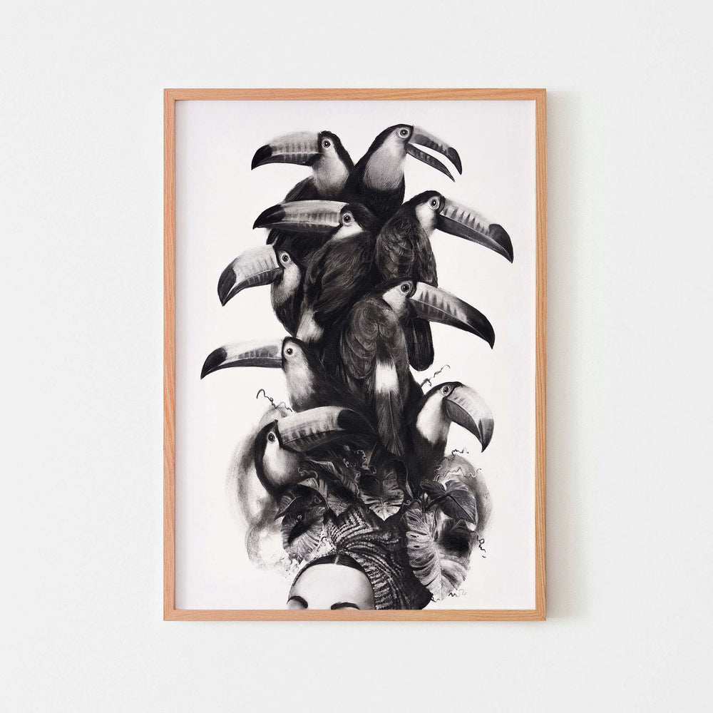 
                  
                    Monochrome wall art poster of a women wearing a toucan headdress in an oak frame.
                  
                