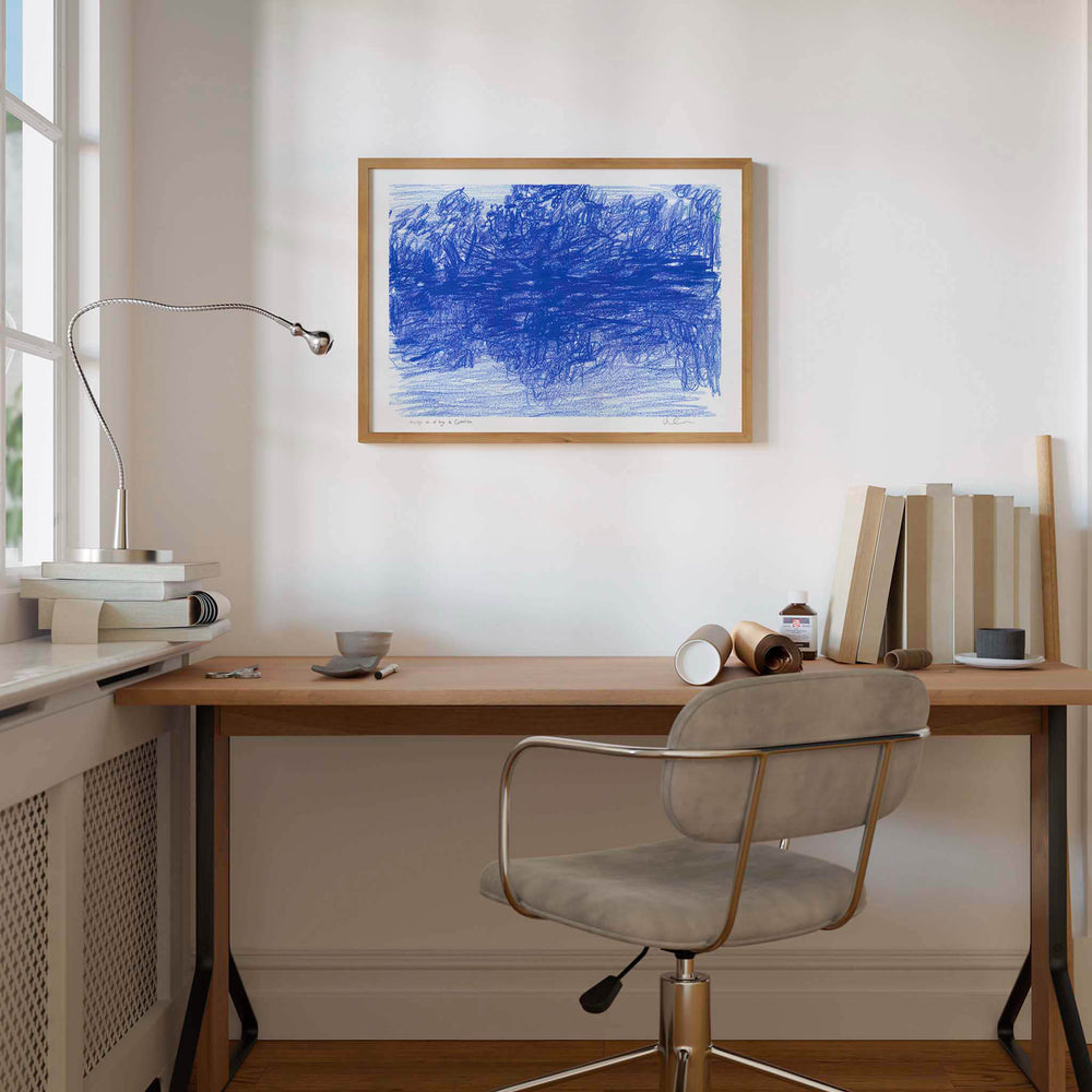 
                  
                    Framed blue landscape art print in a neutral home office.
                  
                