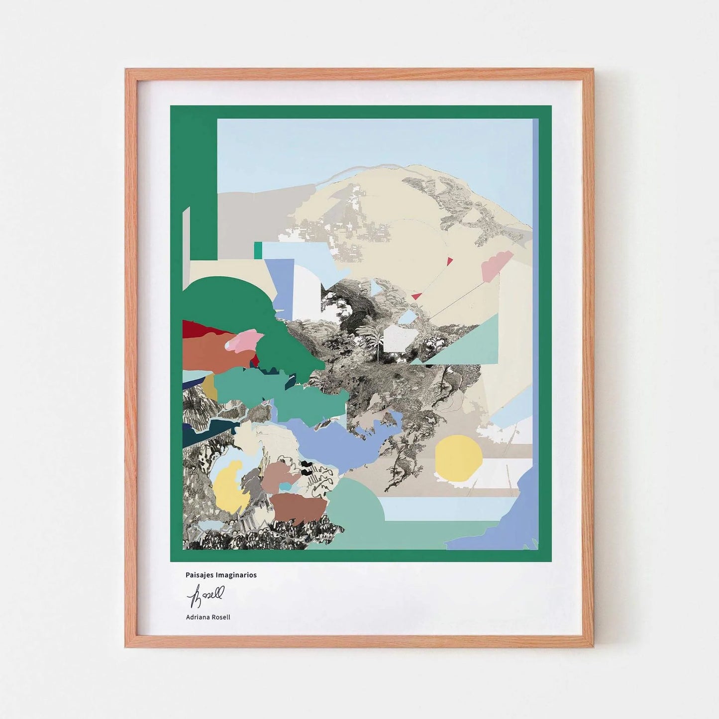 Framed landscape artwork with colorful geometric shapes on a white wall.