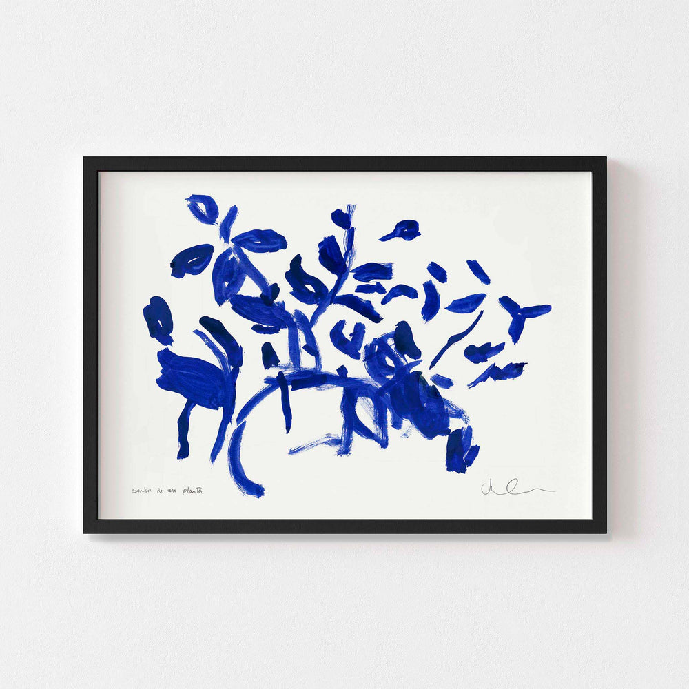 
                  
                    Small blue and white floral wall art print  framed in black.
                  
                