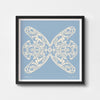 Square blue and white paper cut art print framed in black.