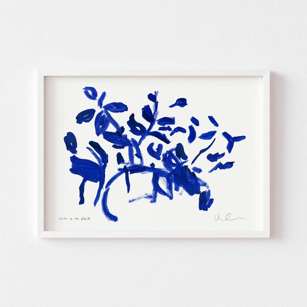 Small blue and white botanical wall art print  framed in white.