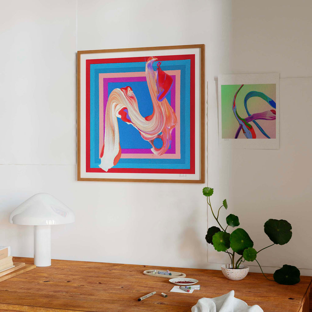 
                  
                    Red and blue framed abstract art print in a contemporary interior.
                  
                