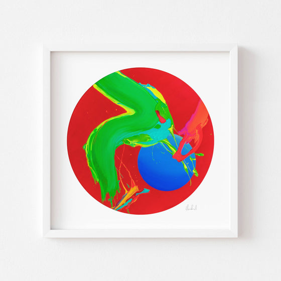 Circular red art print in a white frame.