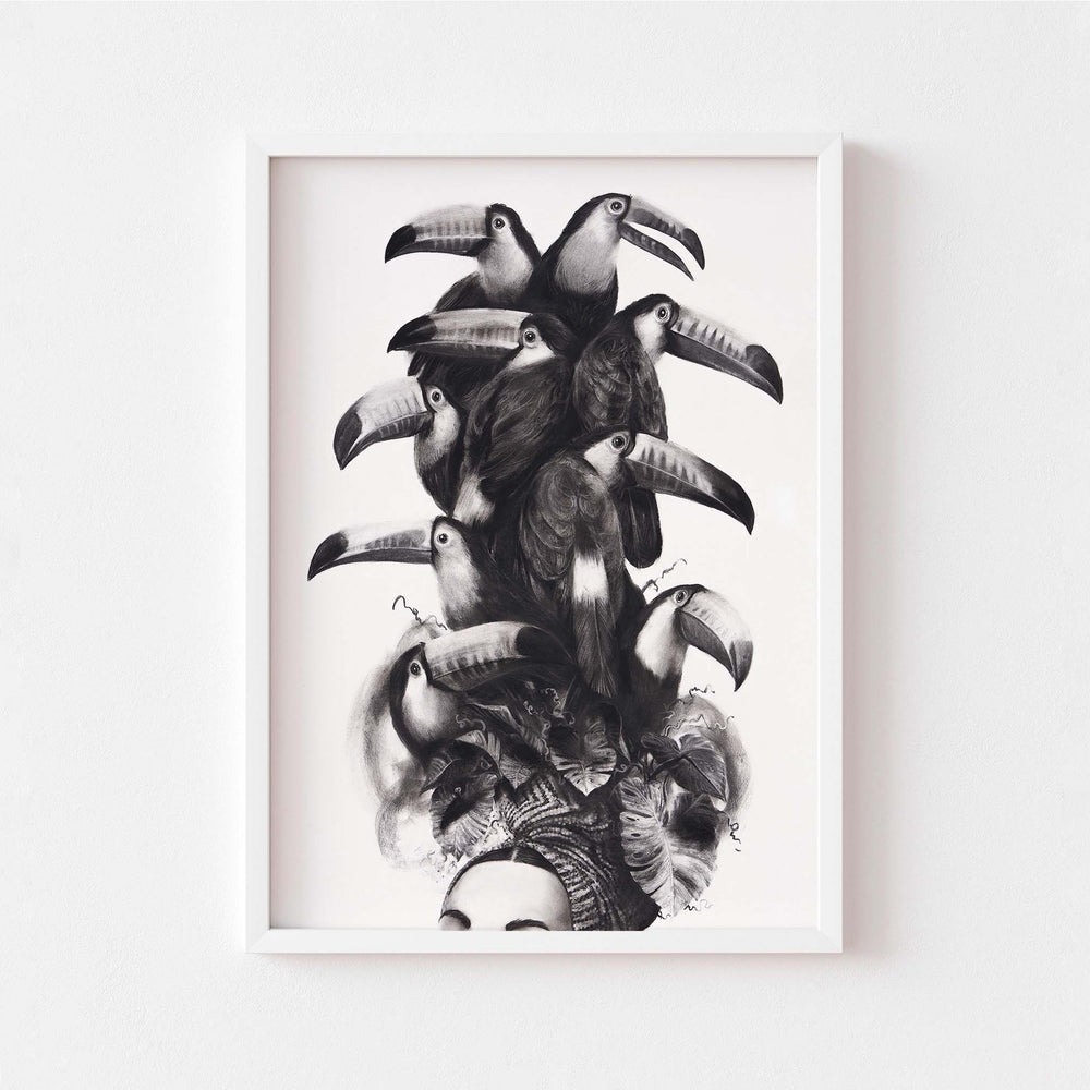 
                  
                    Black and white wall art print of a women wearing a toucan headdress in a white frame.
                  
                