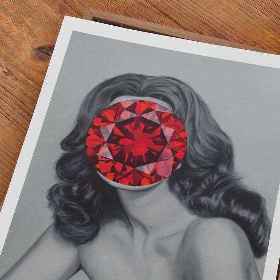 Unframed wall art print of a woman with a red gem covering her face.