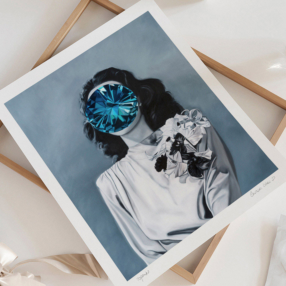 
                  
                    Unframed wall art print of a woman with a blue gem covering her face.
                  
                