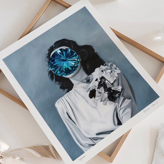 Unframed wall art print of a woman with a blue gem covering her face.