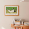 Small framed art print of a fainting goat in a neutral living space.