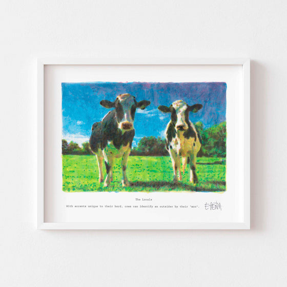 Modern wall art print of two cows framed in white.